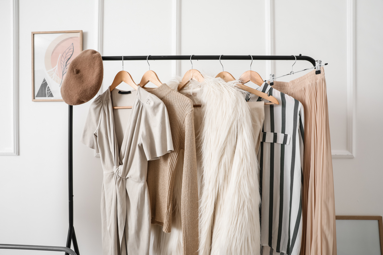 Rack with Stylish Clothes in Modern Studio of Fashion Stylist